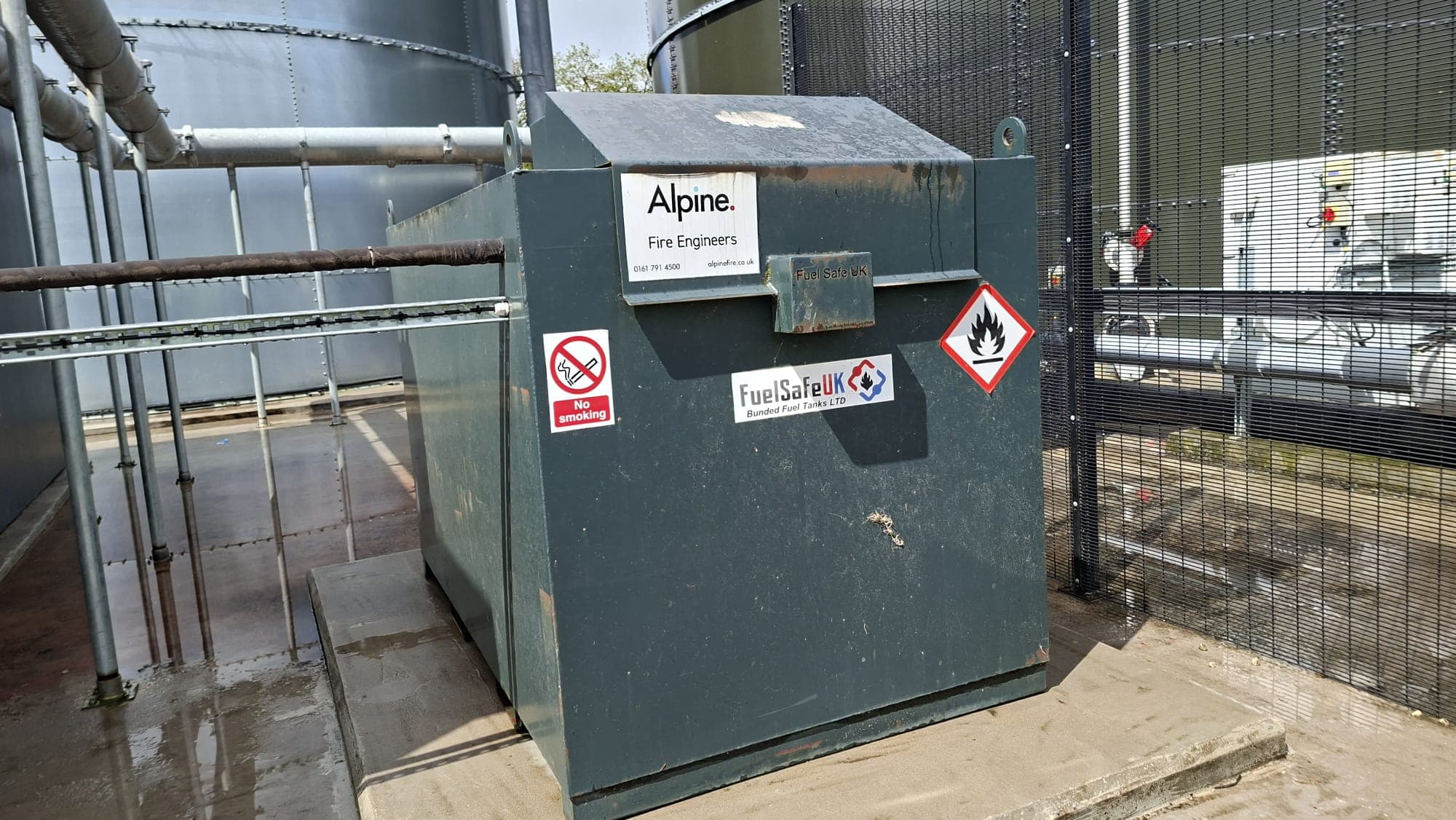 Large flammable liquid storage tank at an industrial site