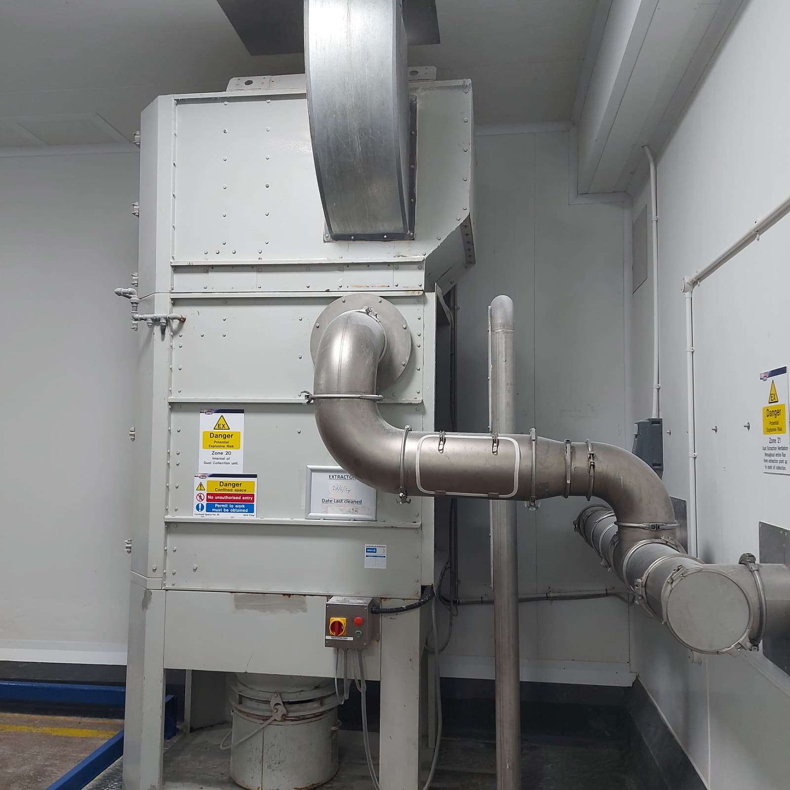 Dust collection and extraction unit with Zone 20 and Zone 22 hazardous area signage