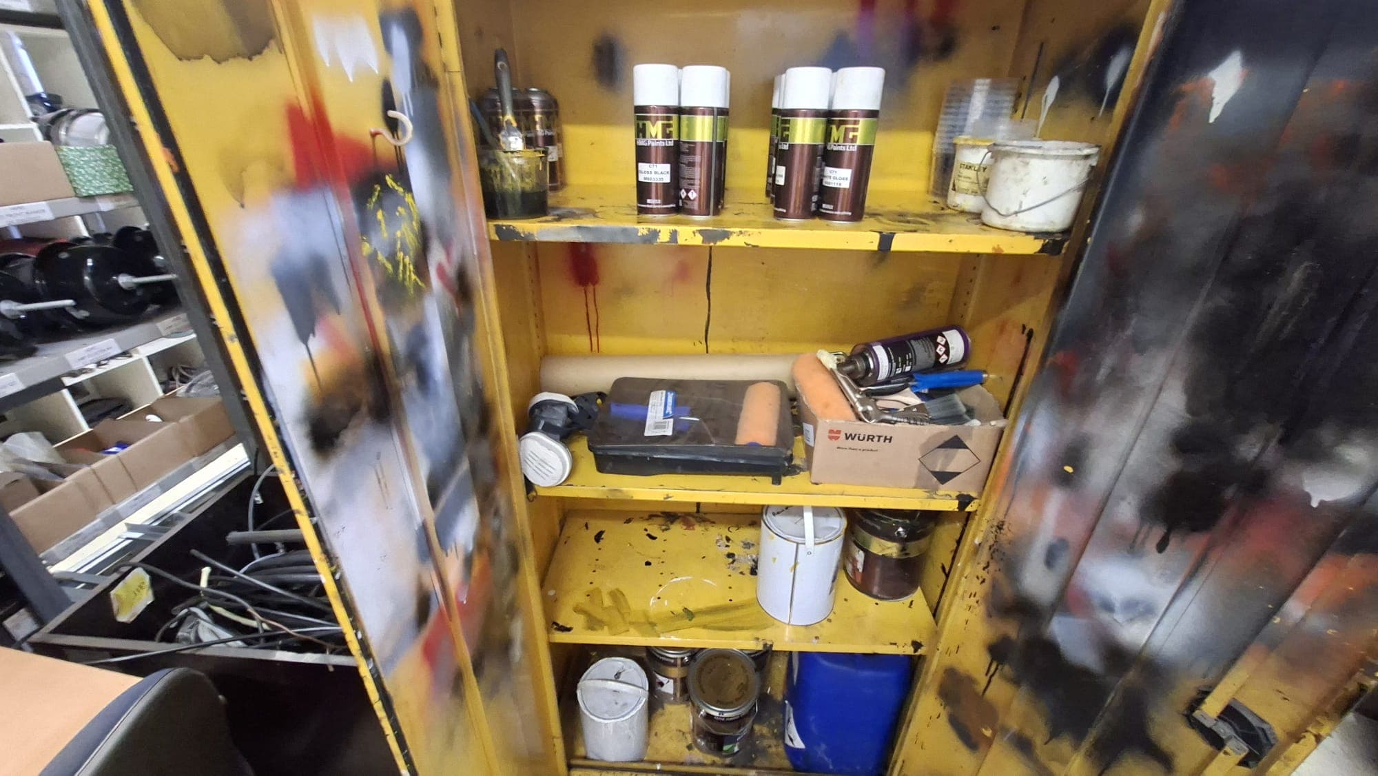 Flammable product storage cabinet in a vehicle refurbishment workshop